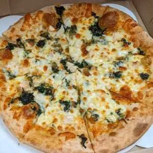 Chicken Spinach Pizza with tomatoes, spinach blend, onions &amp; chicken