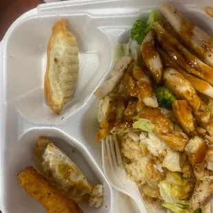 Chicken teriyaki plate. Very good quality and reasonable price. gyoza dumplings and two fried zucchini sticks with chicken teriyaki.