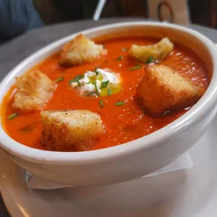 a bowl of soup with croutons