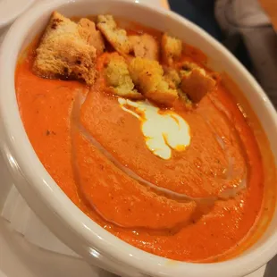 a bowl of soup with croutons