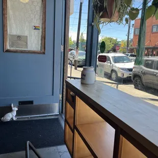 Store front and door from inside, looking on 80th