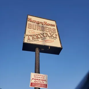 a sign for hungry horse burgers