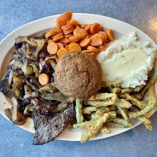 Large liver and onions with mashed potatoes, carrots, and fried green beans