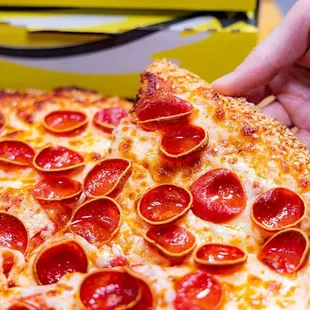 Celebrate 50 Years of Flavor with the &apos;73 Classic, featuring 73 slices of savory pepperoni, gooey cheese, and a crispy crust!