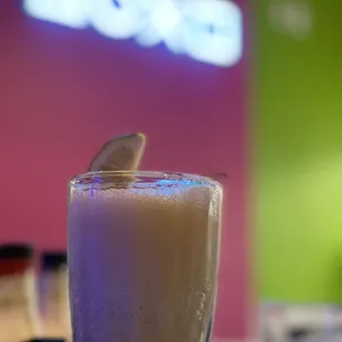 a drink in a tall glass