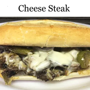 a cheese steak sandwich on a plate