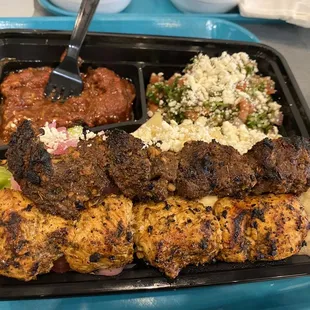 Platter with a variety of sides + I upgraded to 2 different meat skewers. Yum!!!