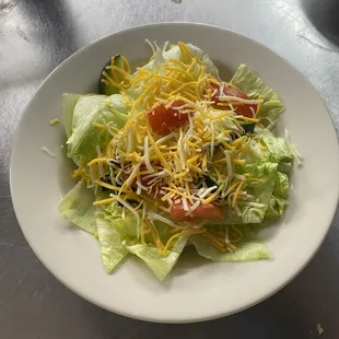 a salad with cheese and lettuce