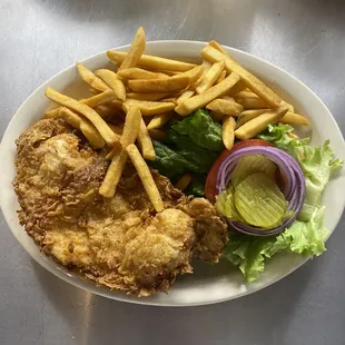 a plate of fried chicken and french fries