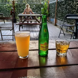 a beer and a glass on a table