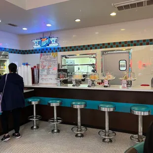 a woman standing at the counter