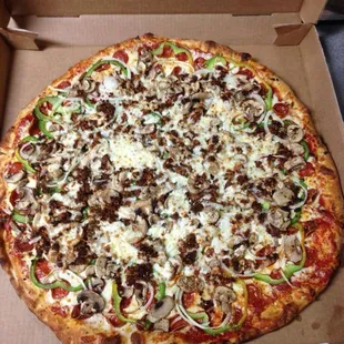 Homemade Supreme Pizza features Rosa Grande Pepperoni, Hot Sausage, Mushrooms, Onions, &amp; Green Peppers
