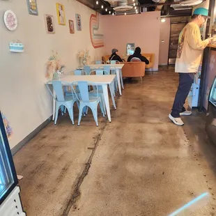 a man standing in a coffee shop