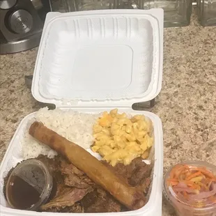 Fall apart delicious brisket with Mac n cheese and rice ( comes with two sides and your choice of lumpia). Huge portions and so good!