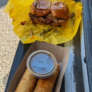 a sandwich and two rolls