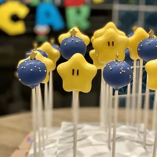 Mario Star cake pops with funfetti, and blue round cake pops with vanilla filling.