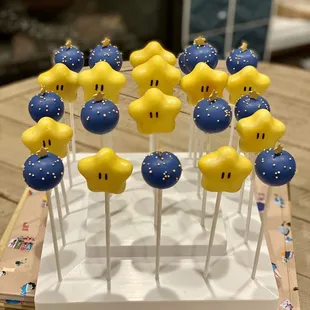 Mario Star cake pops with funfetti, and blue round cake pops with vanilla filling.