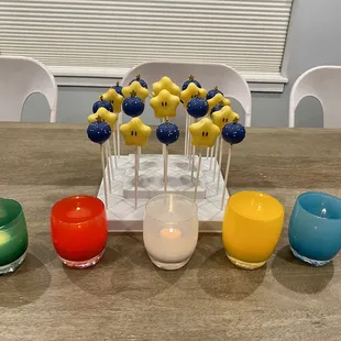 Mario Star cake pops with funfetti, and blue round cake pops with vanilla filling.