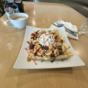 Crepes strawberry, banana, and Nutella.