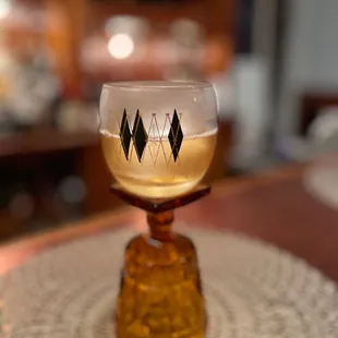 a wine glass on a table