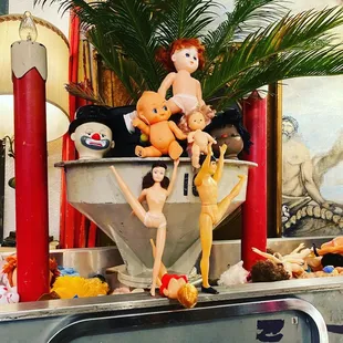 A bin full of heads and dolls