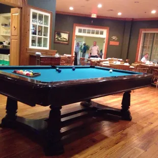 Pool table in middle of room