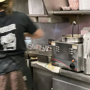 a man working in a commercial kitchen