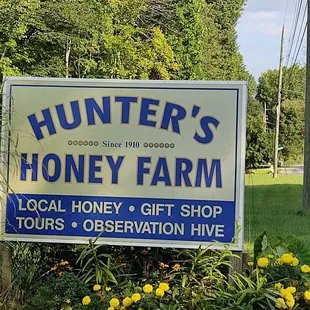 a sign for a local honey farm