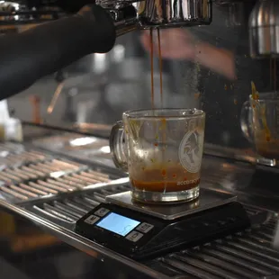 coffee being poured into a glass