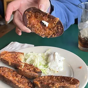 a plate of food and a glass of beer
