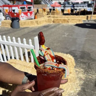 Agua Fresca watermelon flavored with Taheen and Chamoy with sweet and sour candy