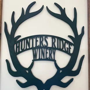 antlers in the center of the sign