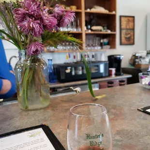 a glass of wine on the bar