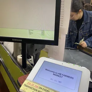 Register with fees for both debit or credit card