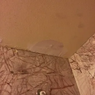 Second hole in bathroom ceiling