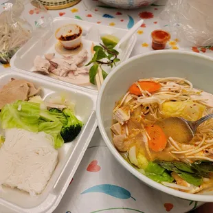 a bowl of soup and a plate of rice