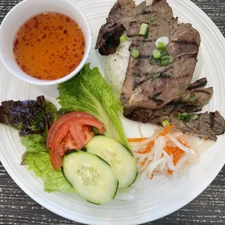 V50. Grilled Pork Chop Over Rice