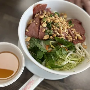 a bowl of food and a cup of coffee