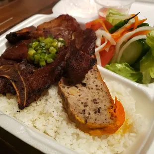 42. Rice plate with pork chop, meatloaf and pork skin.