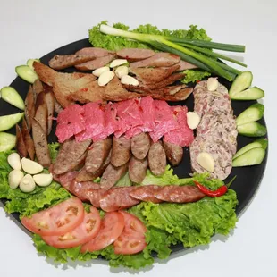 a plate of meat and vegetables