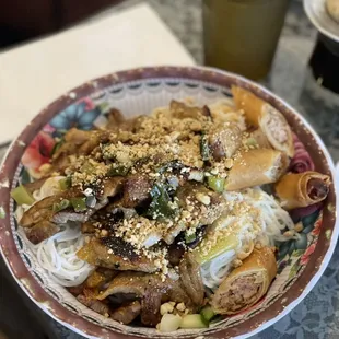 a bowl of noodles and meat
