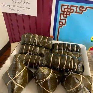 bánh chưng - banana leaves filled with sticky rice, mung bean and pork.