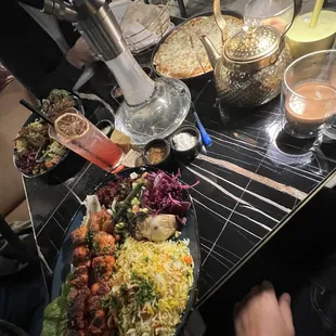 a table full of food and drinks