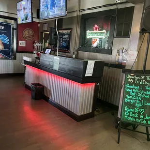 Side entertainment area and plenty of tv's