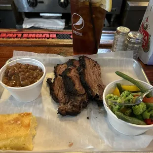 Brisket dinner with two sides .