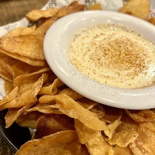 Old Bay Kettle Chips &amp; Queso - Crispy kettle chips w/ Old Bay seasoning, creamy queso w/ hint of jalapeño &amp; red pepper