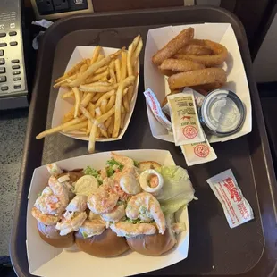 Seafood roll with fries and onion rings