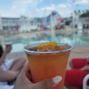 a person holding a drink