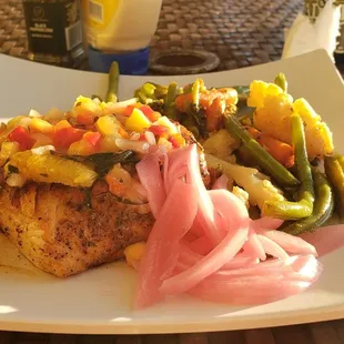 Their Mahi Mahi with seasoned veggies and mango salsa. It was delicious and the perfect portion. I&apos;m not extremely stuffed and over full.