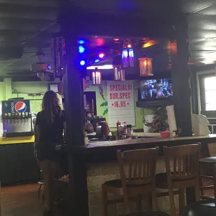 a woman standing at the bar